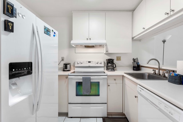 kitchen with sink, white appliances, light tile patterned flooring, and white cabinets