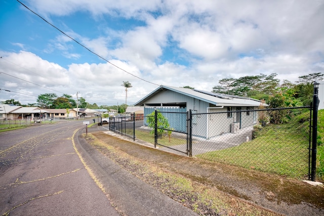 exterior space with a garage, a yard, and an outdoor structure