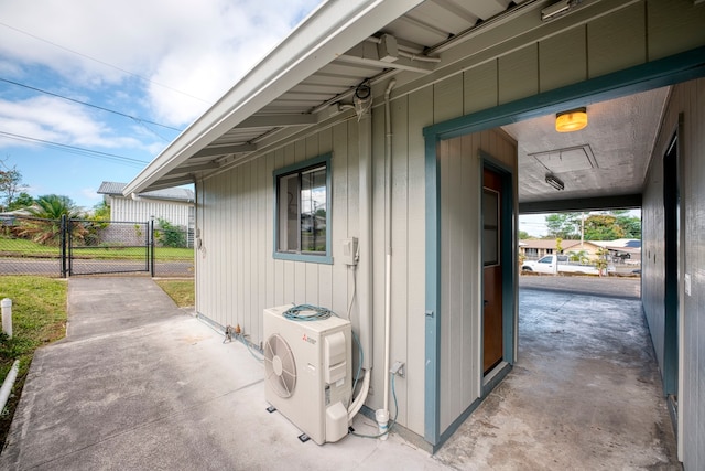 entrance to property featuring a patio and ac unit