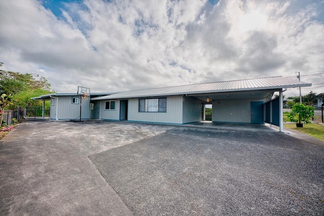 view of front of property featuring a carport