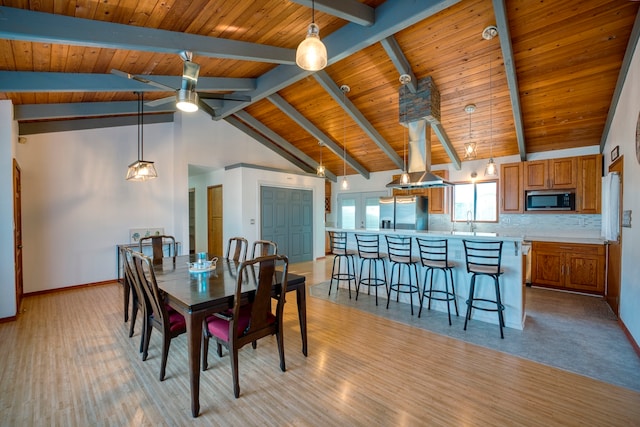 dining area with wood ceiling, sink, high vaulted ceiling, beam ceiling, and light hardwood / wood-style flooring