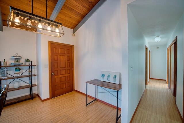 foyer with hardwood / wood-style flooring, vaulted ceiling, and wood ceiling