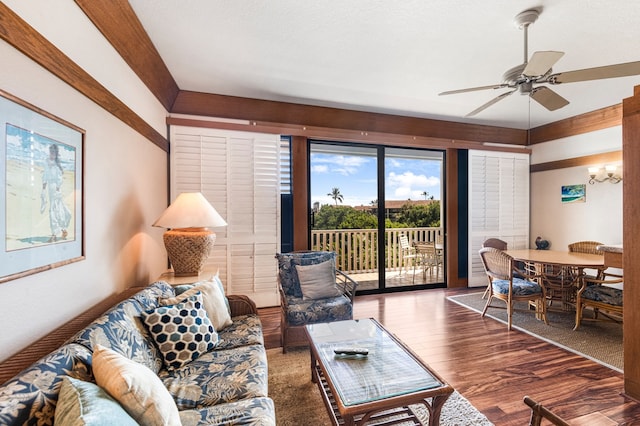 living room with wood-type flooring and ceiling fan