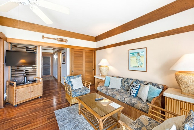 living room featuring dark hardwood / wood-style floors and ceiling fan