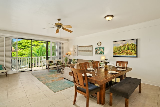 dining area featuring light tile patterned floors and ceiling fan