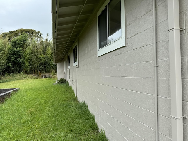 view of home's exterior with a lawn