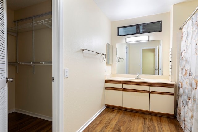 bathroom featuring vanity and hardwood / wood-style flooring