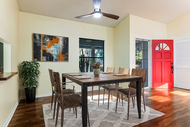 dining area featuring ceiling fan, a textured ceiling, and dark hardwood / wood-style flooring