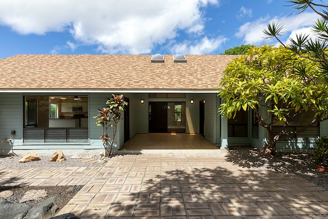 rear view of property featuring a patio area