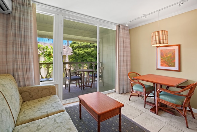 interior space with rail lighting, light tile patterned floors, and a wall unit AC