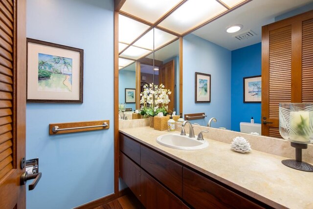 bathroom featuring hardwood / wood-style flooring and vanity