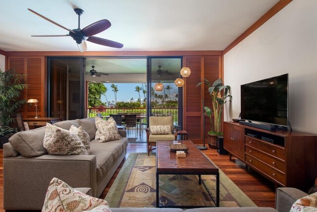 living room featuring hardwood / wood-style flooring and ceiling fan