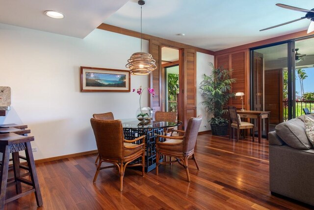 dining room with hardwood / wood-style floors and ceiling fan