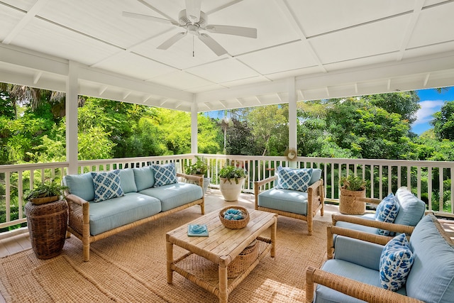 deck featuring ceiling fan and an outdoor hangout area