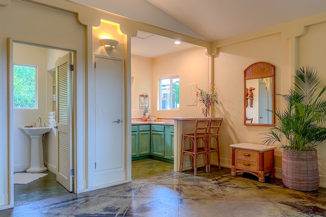 interior space with tile patterned floors and lofted ceiling