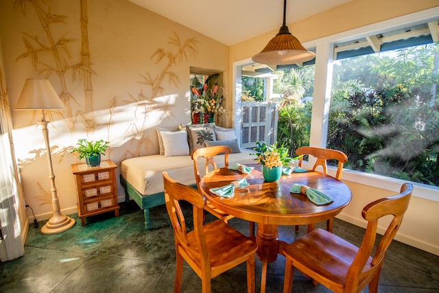 dining area featuring lofted ceiling