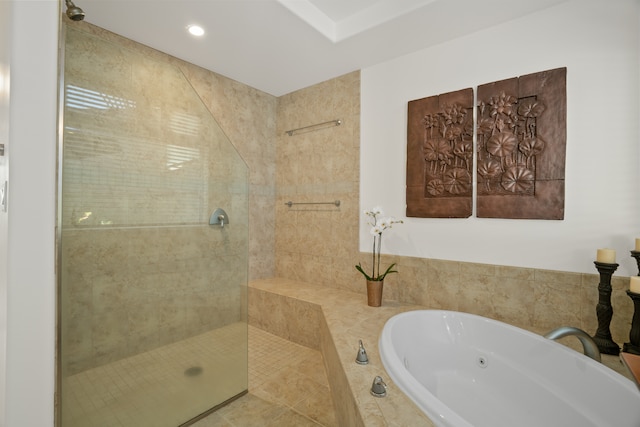 bathroom with plus walk in shower and tile patterned flooring