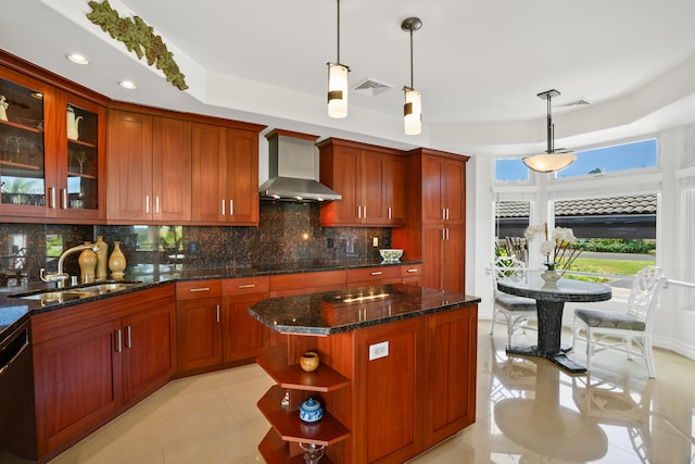 kitchen with decorative backsplash, wall chimney range hood, pendant lighting, light tile patterned flooring, and a kitchen island