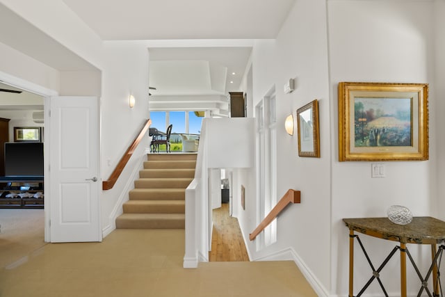 staircase featuring tile patterned flooring