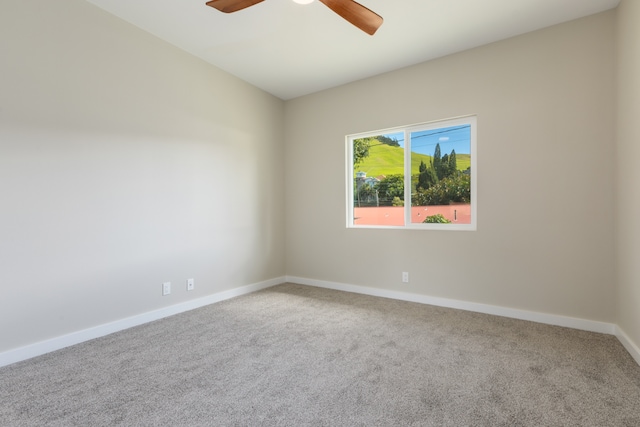 carpeted empty room with ceiling fan