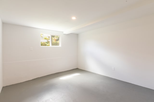 empty room with concrete flooring