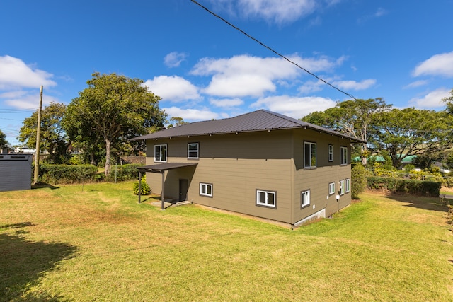 view of home's exterior with a lawn