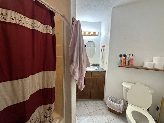 full bathroom with vanity, shower / bath combo, a textured ceiling, tile patterned floors, and toilet