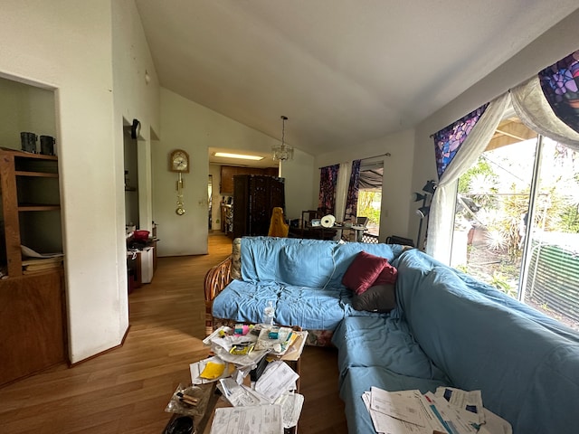 living room with lofted ceiling and hardwood / wood-style floors