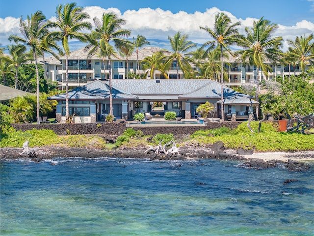 back of property with a water view