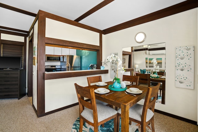 dining room featuring carpet flooring