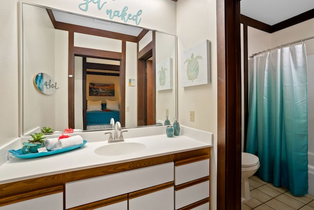 full bathroom featuring vanity, toilet, tile patterned floors, and shower / bath combo with shower curtain