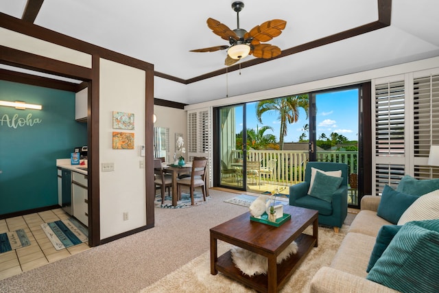 carpeted living room with ceiling fan