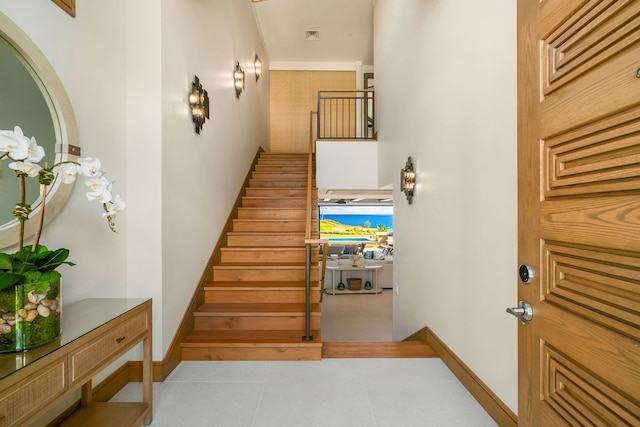 stairs featuring tile patterned floors