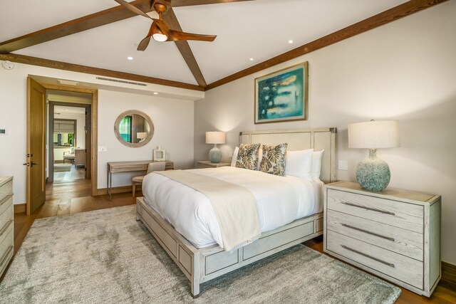 bedroom featuring lofted ceiling with beams, ceiling fan, and wood-type flooring