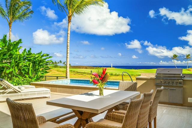 view of patio featuring area for grilling and exterior kitchen