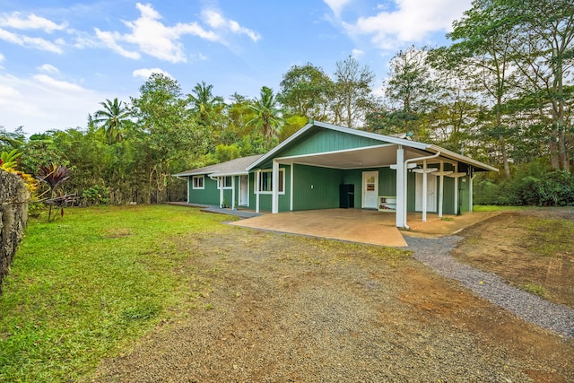 rear view of house with a yard