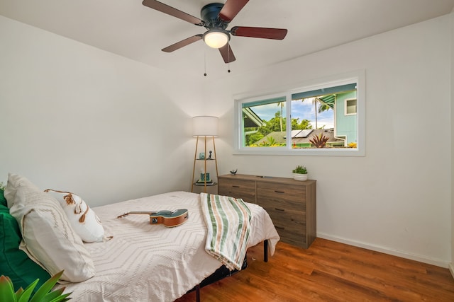 bedroom featuring hardwood / wood-style floors and ceiling fan