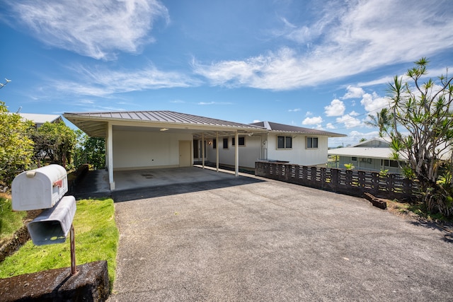 view of front of house with a carport