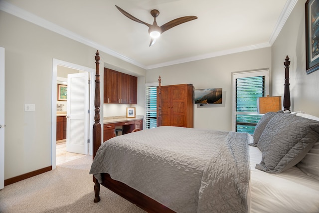 carpeted bedroom with ornamental molding, multiple windows, ensuite bathroom, and ceiling fan