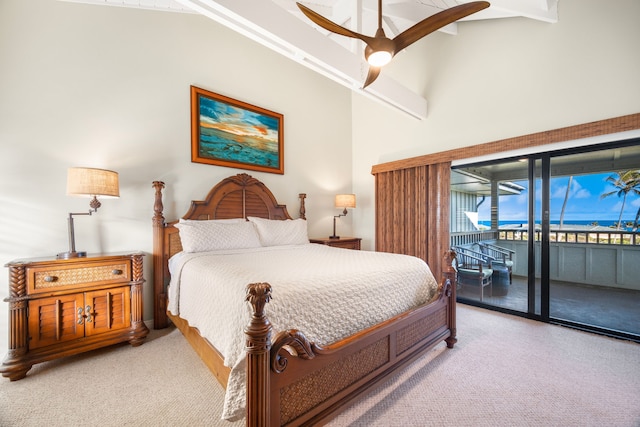 bedroom featuring a high ceiling, access to exterior, ceiling fan, and carpet