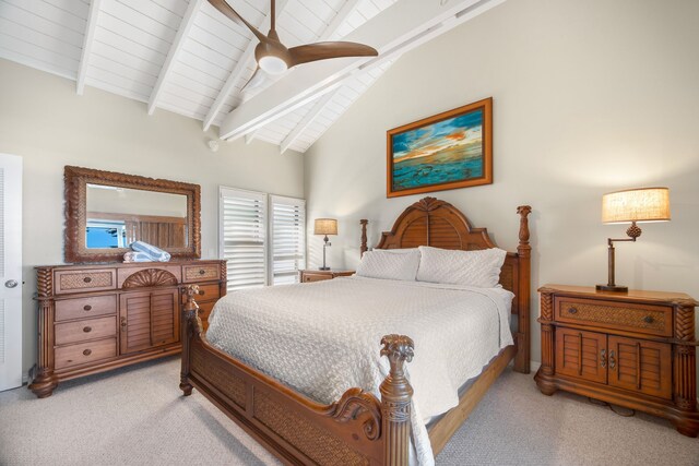 bedroom featuring lofted ceiling with beams, light colored carpet, and ceiling fan