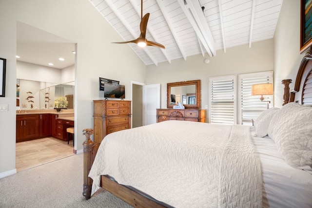 bedroom with beamed ceiling, ensuite bath, ceiling fan, wood ceiling, and light colored carpet