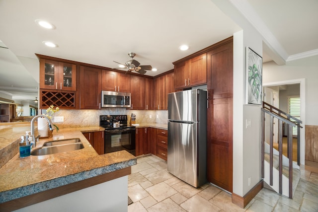 kitchen featuring backsplash, appliances with stainless steel finishes, sink, ceiling fan, and ornamental molding