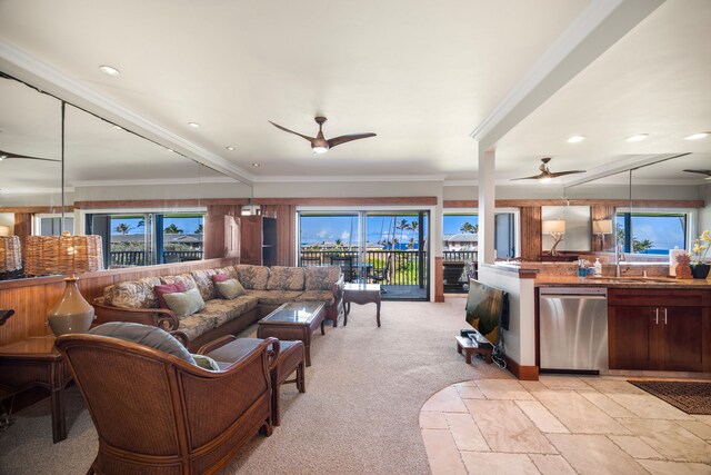 carpeted living room featuring ceiling fan and a wealth of natural light