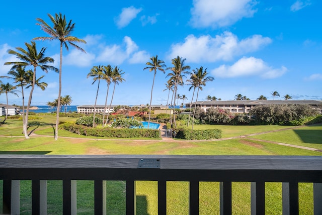 exterior space featuring a water view and a yard