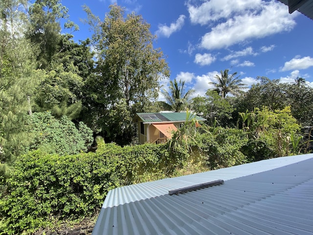 details with a downspout and metal roof