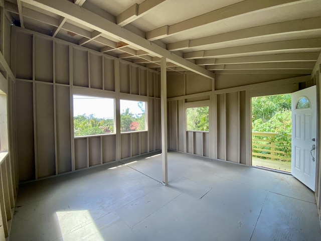 unfurnished sunroom with vaulted ceiling