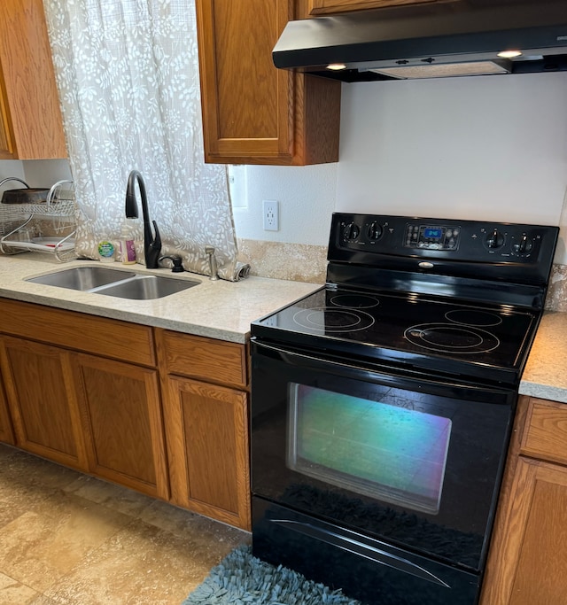 kitchen with ventilation hood, black range with electric cooktop, and sink