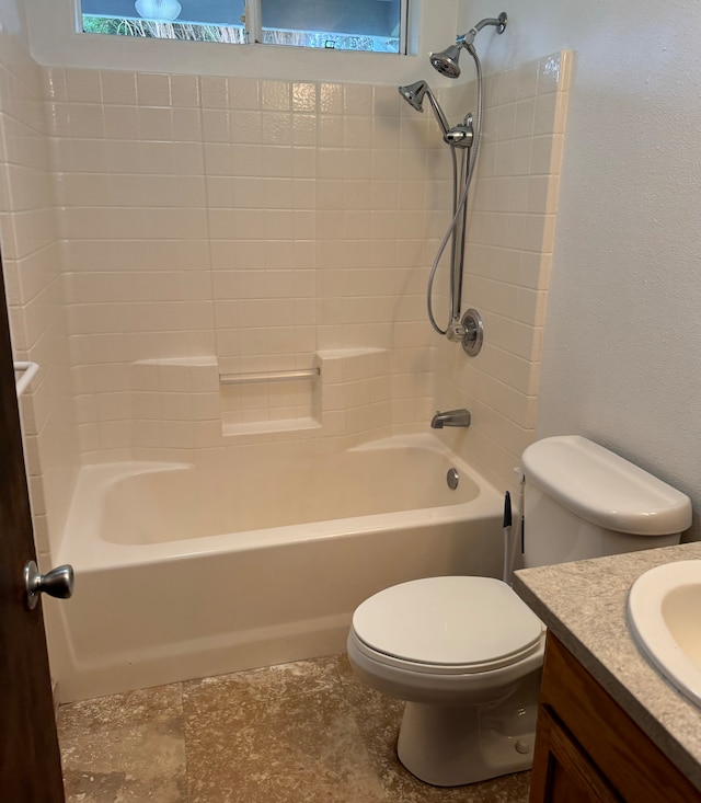 full bathroom featuring vanity, tub / shower combination, and toilet