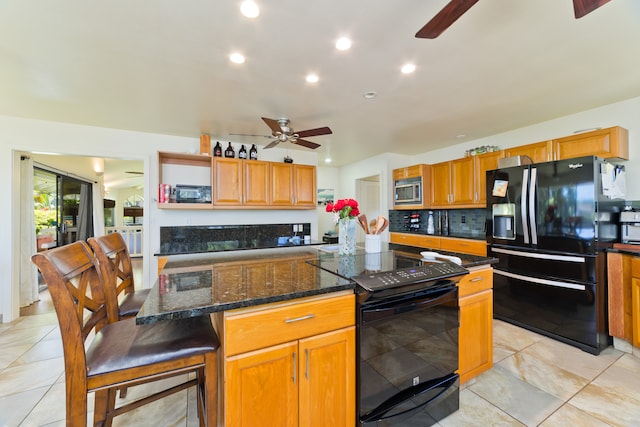 kitchen with backsplash, ceiling fan, light tile patterned floors, and black appliances